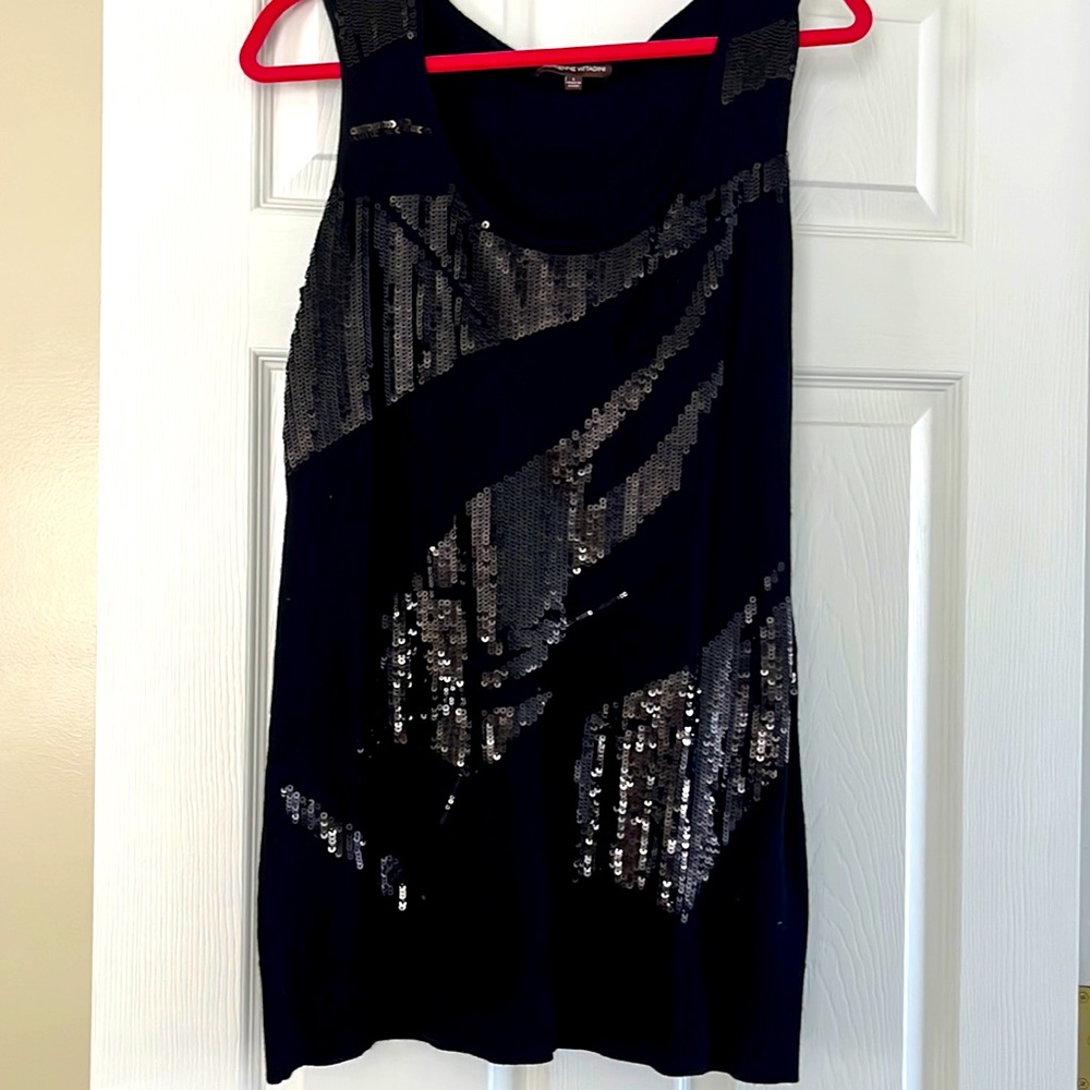 Chic Black dress with embellishment across front.
